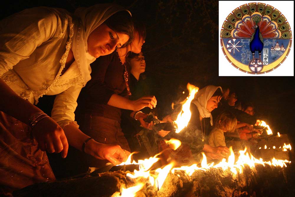 Yazidi women light candles and torches outside Lalesh temple during a ceremony to celebrate the Yazidi New Year, on 17 April 2007.